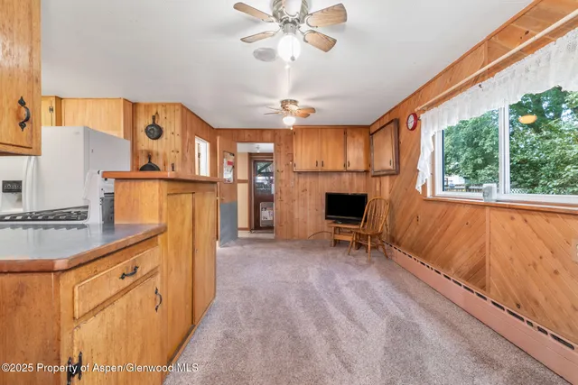 a view of kitchen with furniture and a fireplace