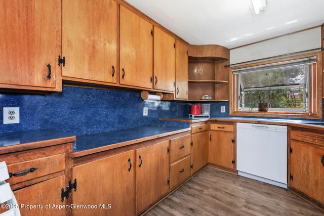 a kitchen with stainless steel appliances granite countertop a sink and cabinets