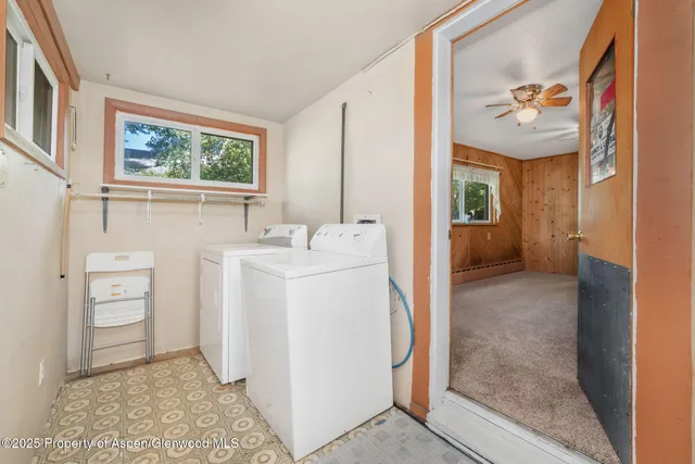 a view of hallway with washer and dryer