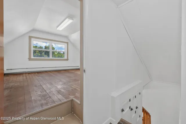 a view of room with window and hallway