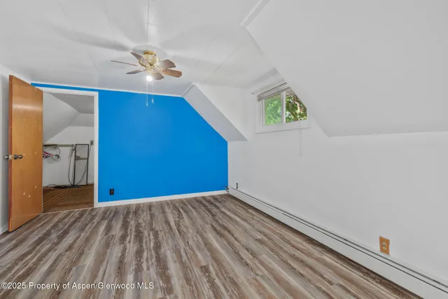 a view of a livingroom with wooden floor