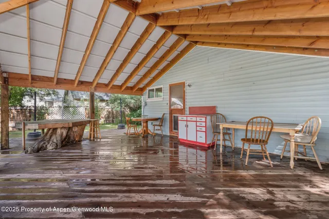 a view of a swimming pool with a table and chairs