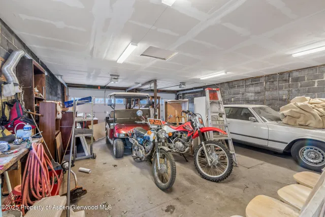 a view of parking garage with cars