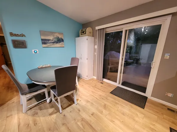 a dining room with furniture and window
