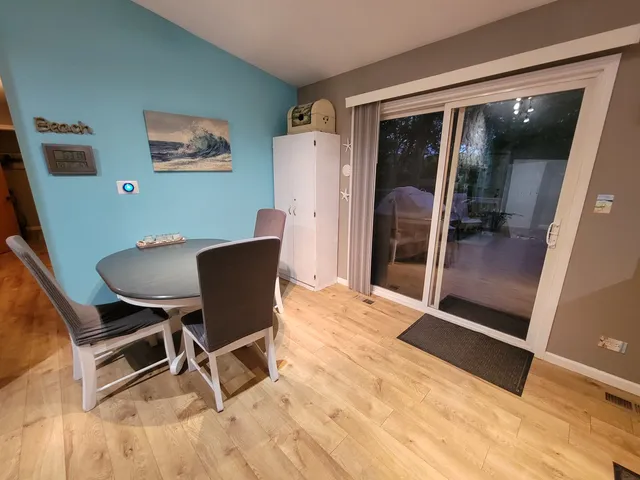 a dining room with furniture and window