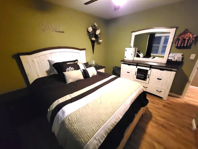 a bedroom with bed and window