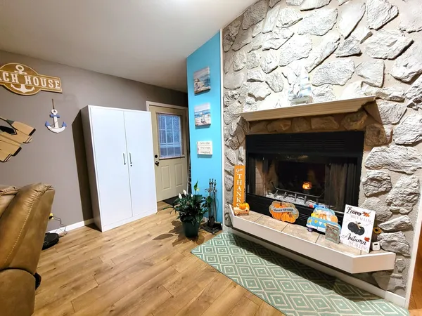 a living room with furniture and a fireplace