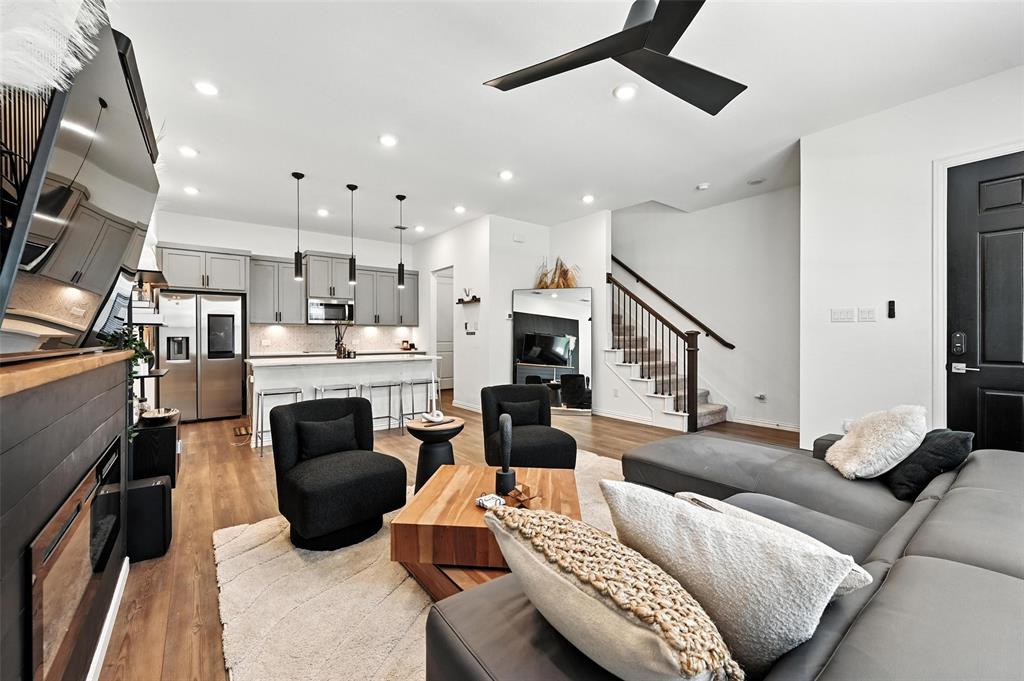 7513 Laburnam Road Dallas, TX 75228 - Photo 5 of 23 a living room with furniture and a fireplace