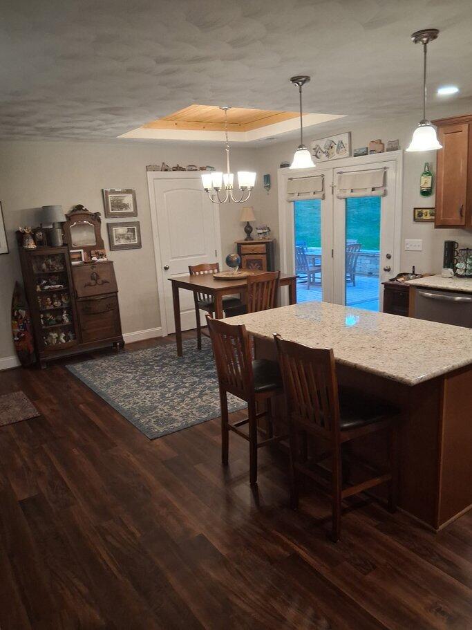 2348 East Ruritan Road Roanoke, VA 24012 - Photo 21 of 31 a kitchen with stainless steel appliances kitchen island granite countertop a table chairs and a refrigerator
