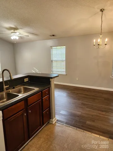 a kitchen that has a sink and cabinets