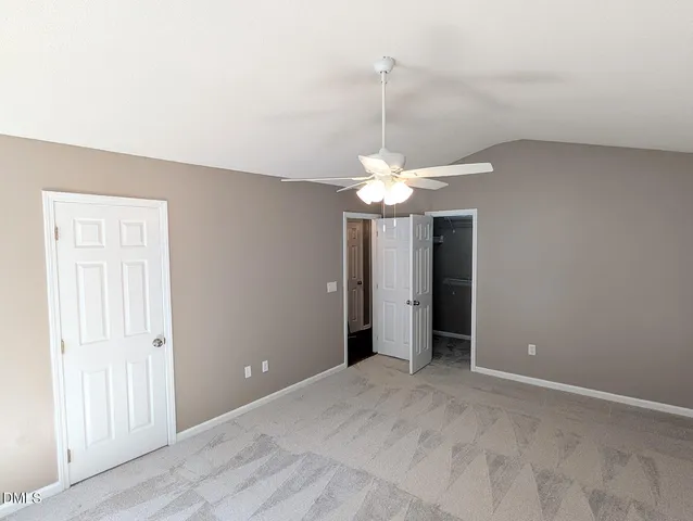 an empty room with a bathroom