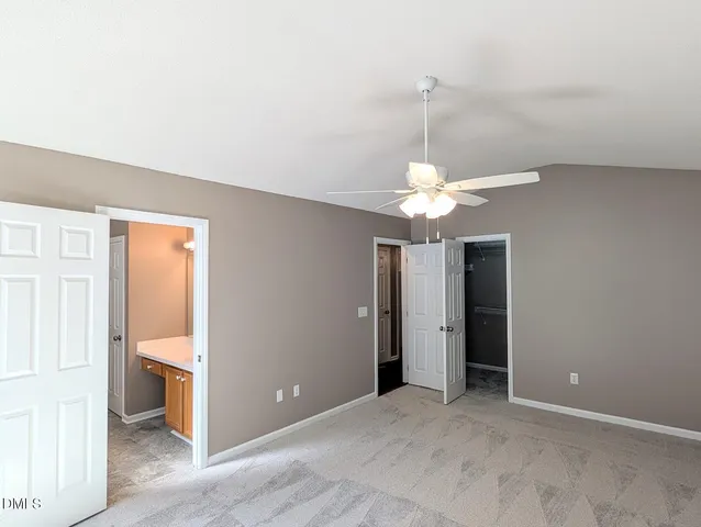 a view of a chandelier fan and entryway