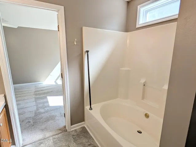 a bathroom with a white tub