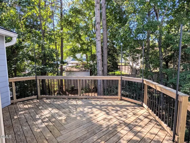a view of a balcony with wooden floor