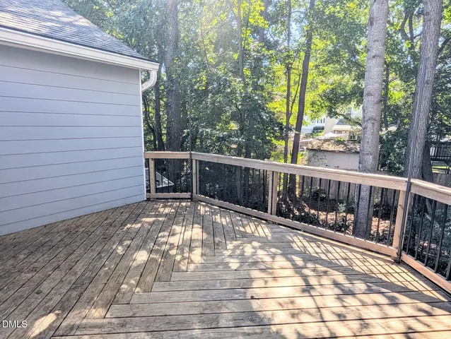 a view of balcony with yard