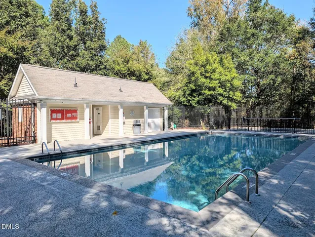 a sign that is sitting in front of flowers