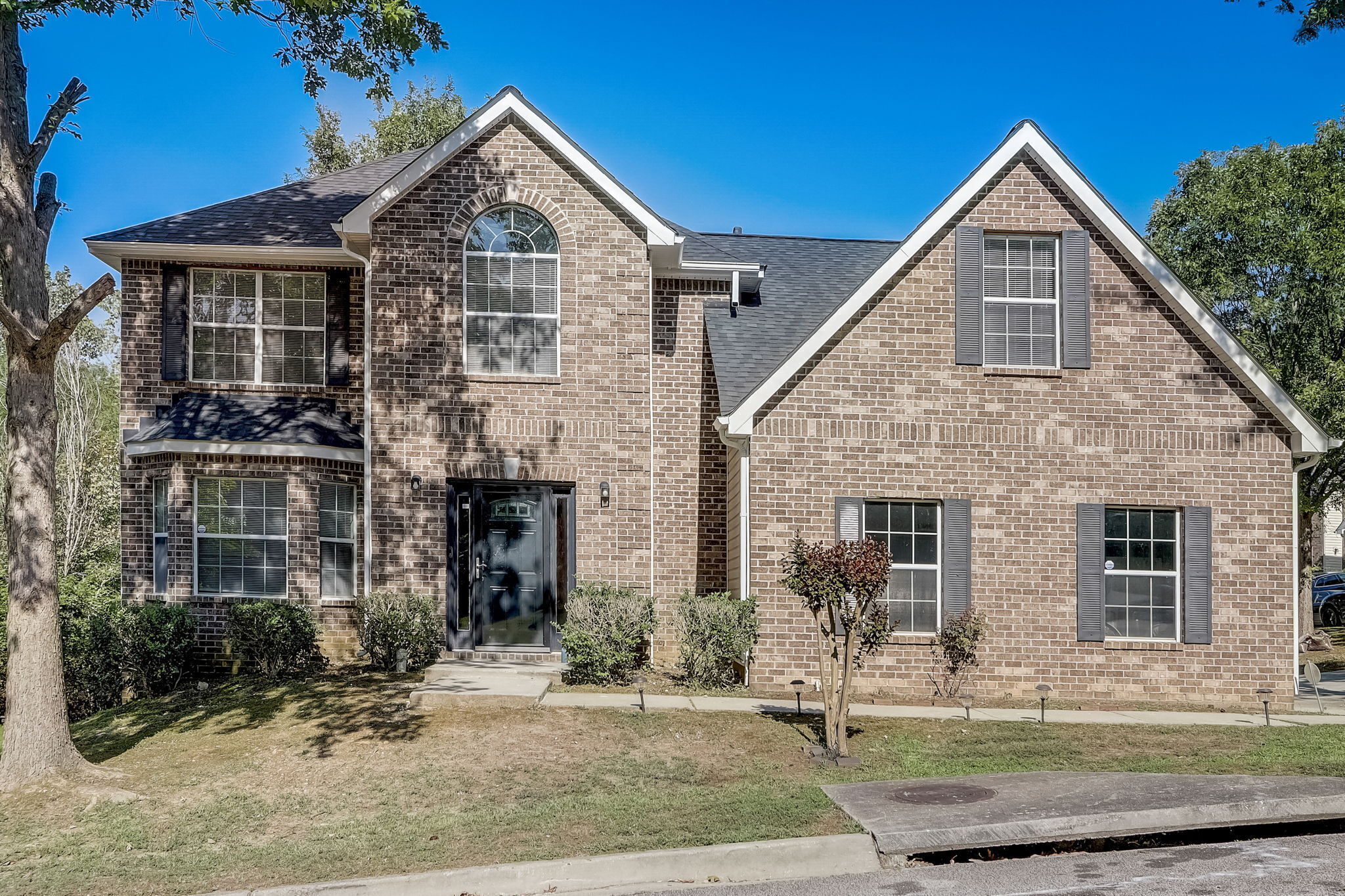 front view of a house with a yard