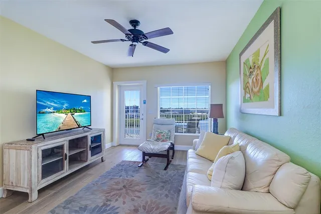 a view of a chairs and table in a balcony