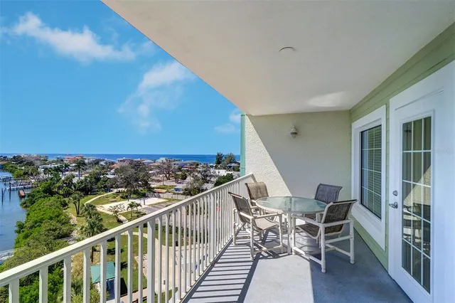 a living room with furniture and a dining table