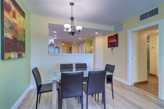 a kitchen with granite countertop a sink stove and refrigerator