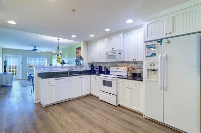 a view of a hallway with washer and dryer