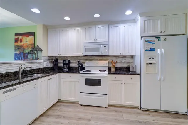 a bedroom with a bed a couch and a window