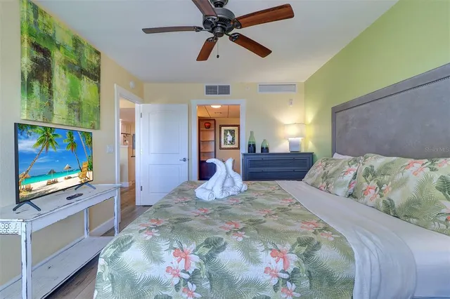 a bedroom with a bed and a dresser in it