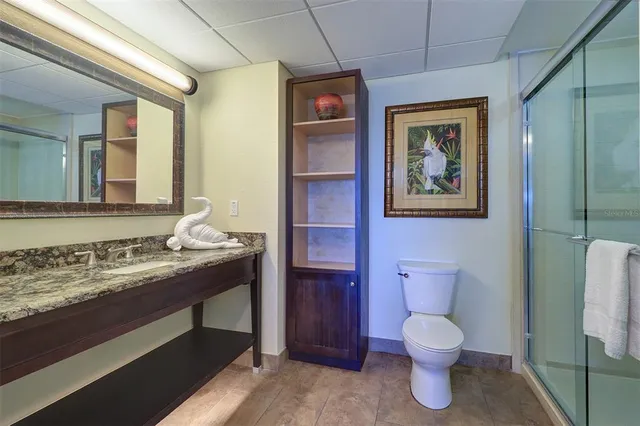 a bedroom with two beds and painting on the wall