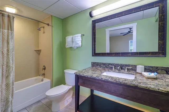 a view of a balcony with wooden chairs