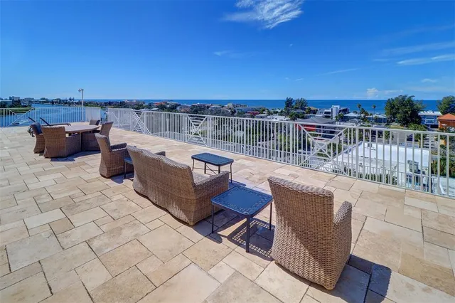 a view of a house with pool and lake view