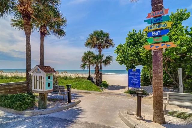 a view of building along with the road and shops