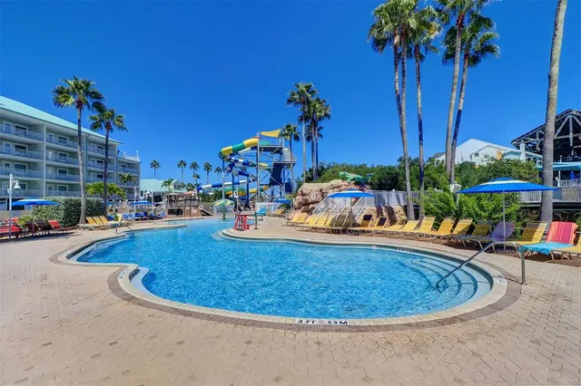 an aerial view of a house with a lake view