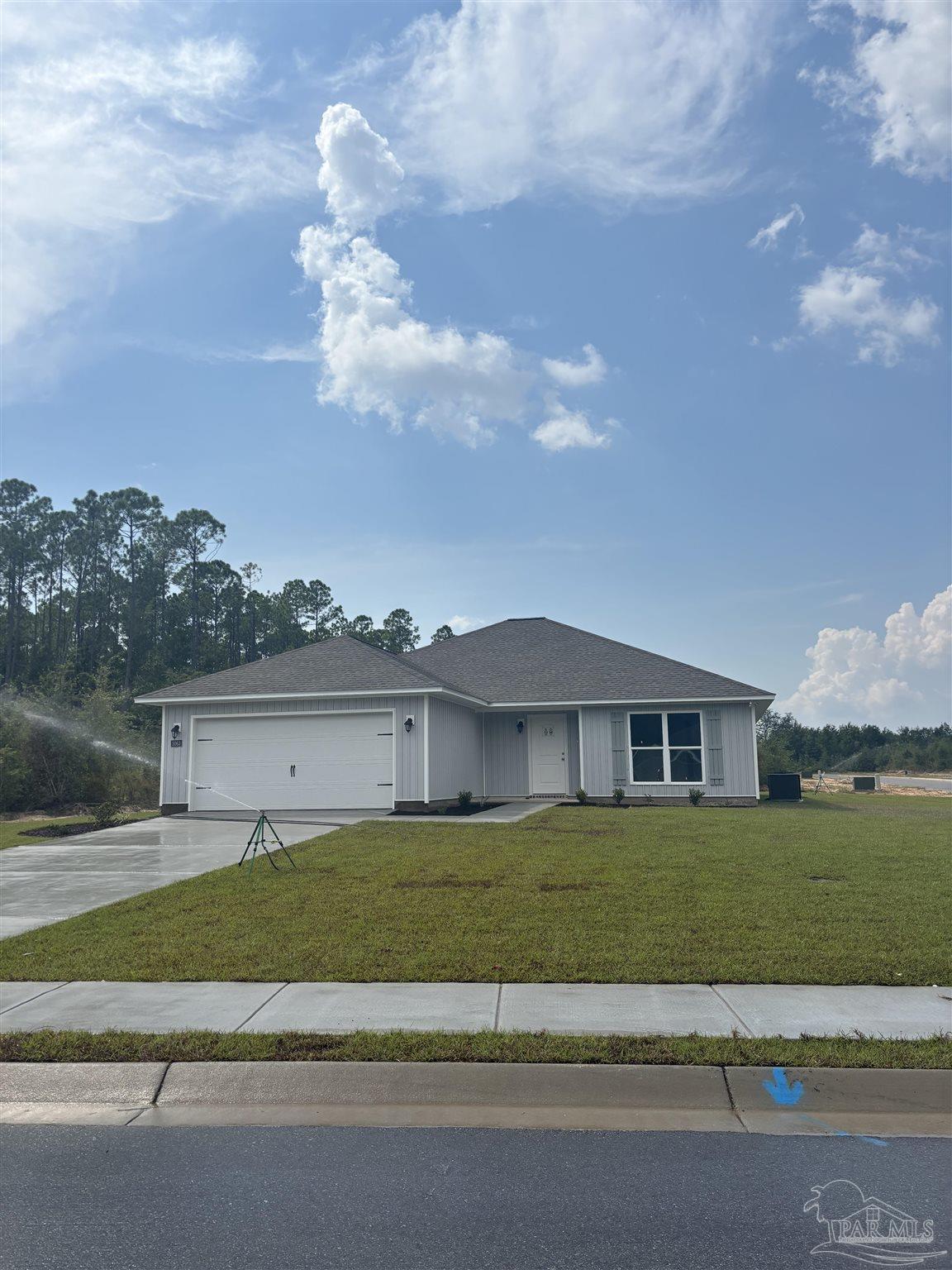 a view of a house next to a yard