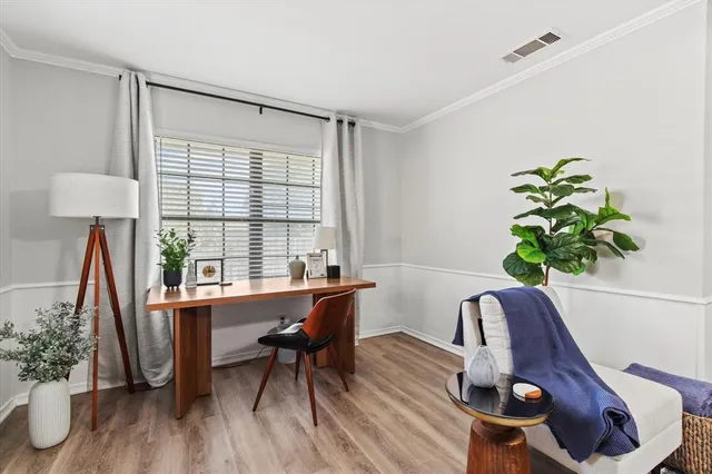 a workspace with furniture and a potted plant
