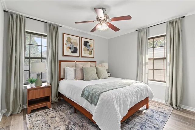 a bedroom with a bed and a window