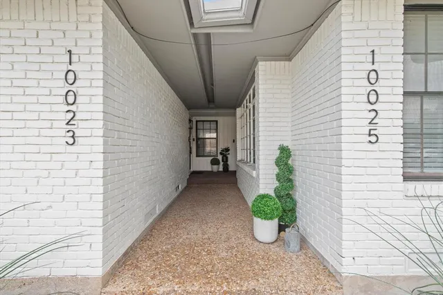 a view of a path along with potted plant