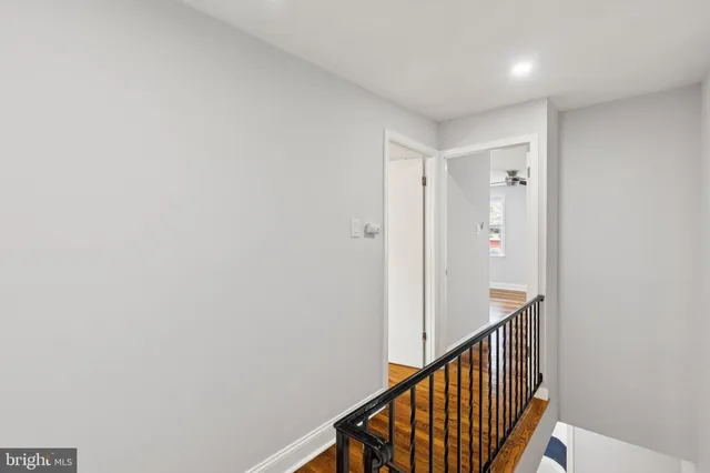a view of a hallway with staircase