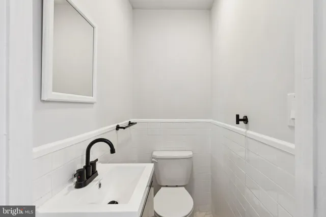 a bathroom with a sink and toilet