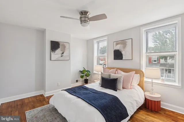 a bedroom with bed and window