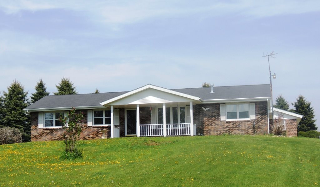 16349 Best Road Davis, IL 61019 - Photo 1 of 25 a front view of a house with a garden