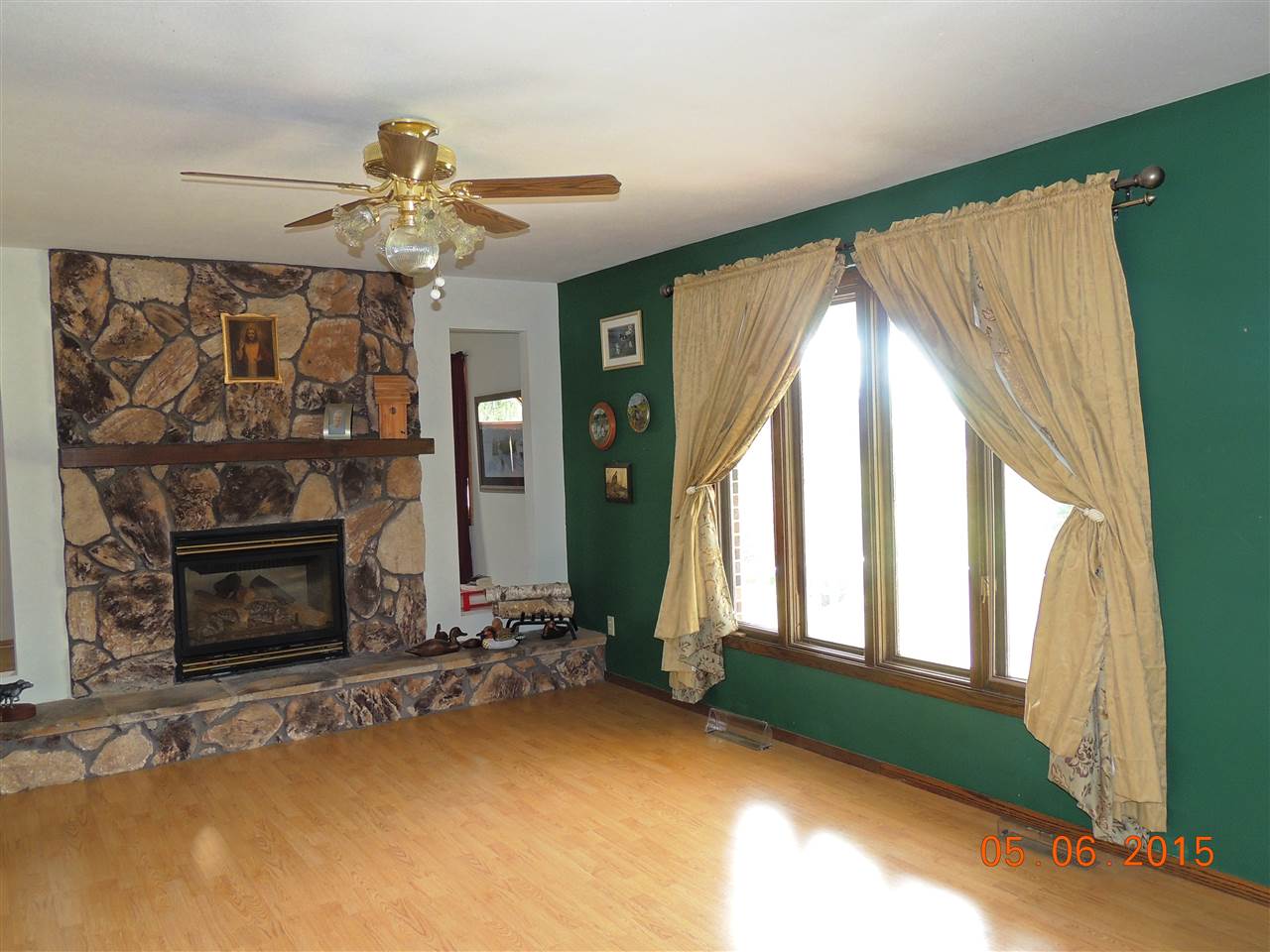 16349 Best Road Davis, IL 61019 - Photo 9 of 25 a view of an empty room with a fireplace and a window