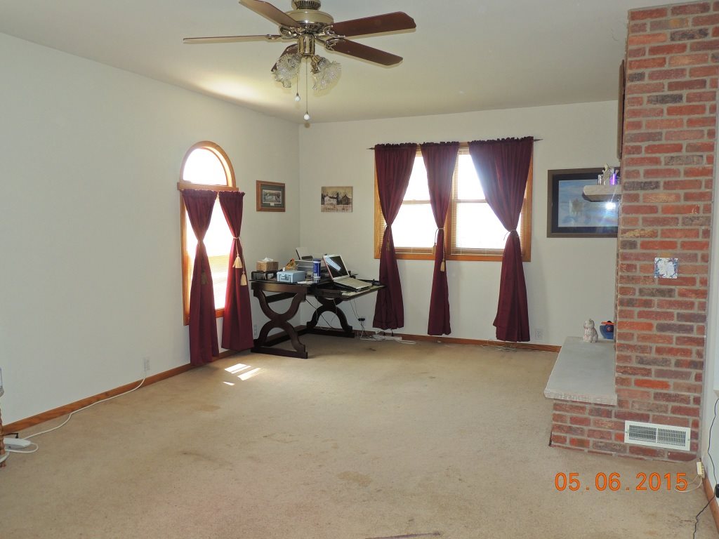 16349 Best Road Davis, IL 61019 - Photo 10 of 25 a view of a livingroom with furniture and a ceiling fan