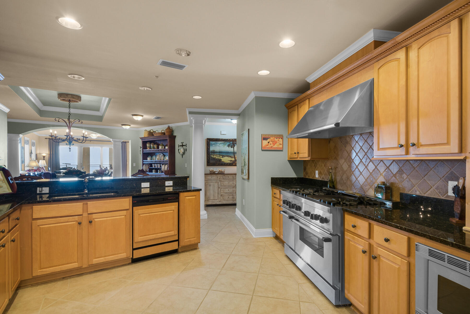 56 Blue Mountain Road, Unit A201 Santa Rosa Beach, FL 32459 - Photo 25 of 76 a kitchen with stainless steel appliances granite countertop a stove a sink and a microwave