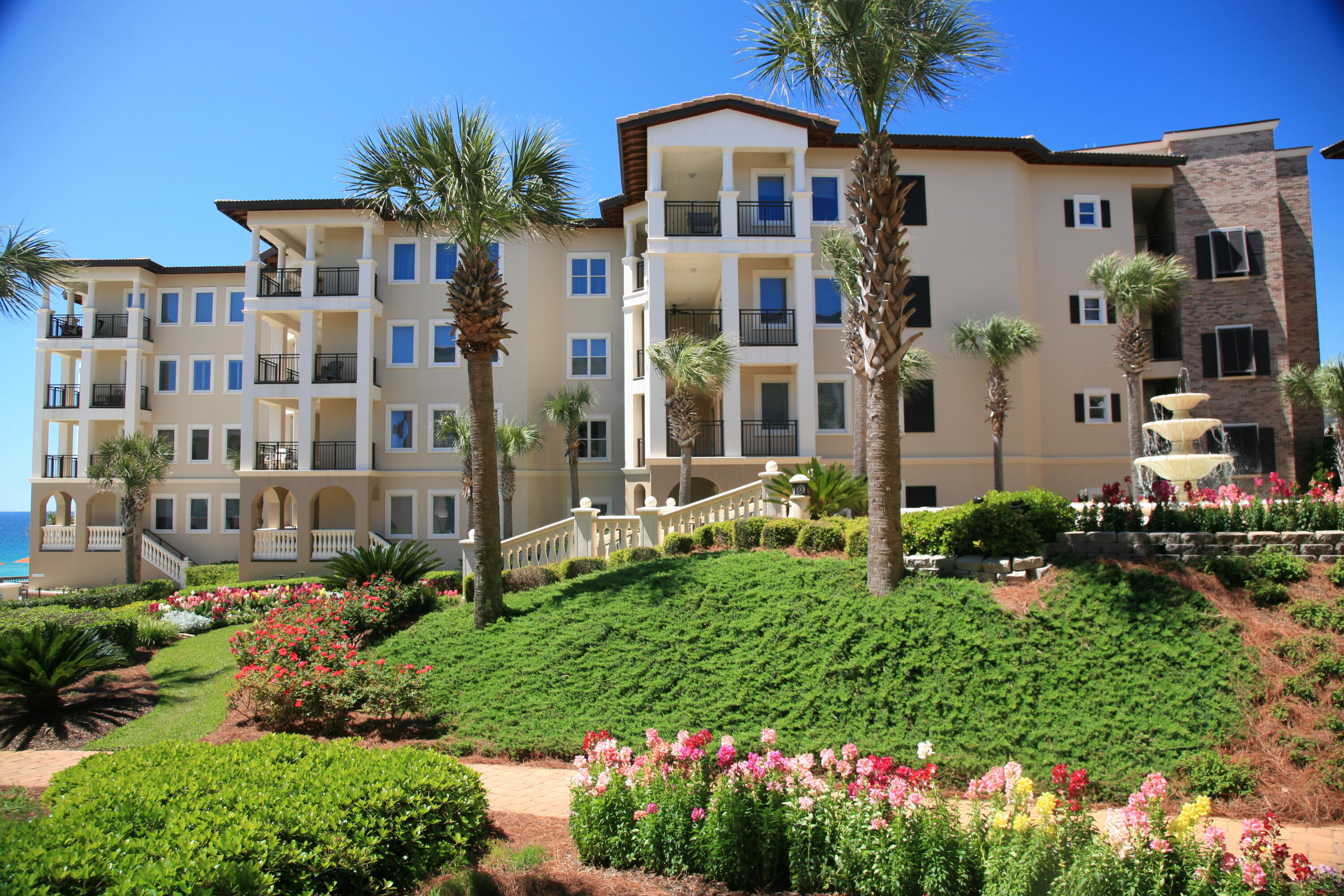 56 Blue Mountain Road, Unit A201 Santa Rosa Beach, FL 32459 - Photo 51 of 76 a front view of a house with a yard and potted plants