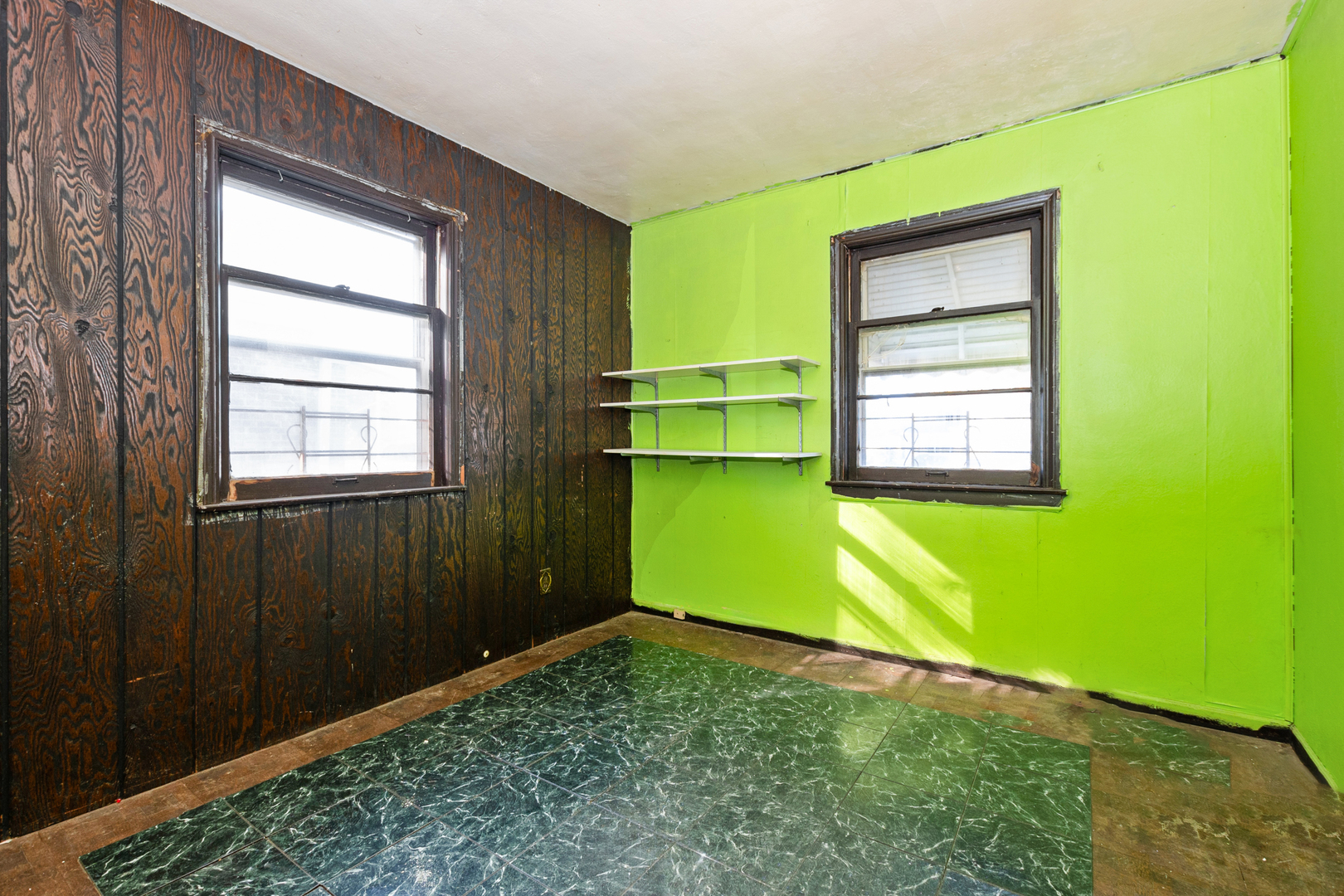 1473 Wentworth Avenue Calumet City, IL 60409 - Photo 11 of 18 a room with a window and a dresser