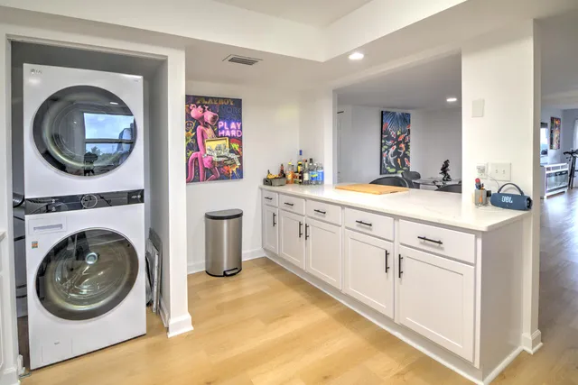 a kitchen with stainless steel appliances granite countertop a stove and a sink