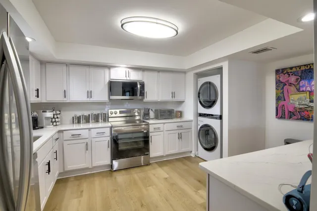 a kitchen with a sink stove and refrigerator