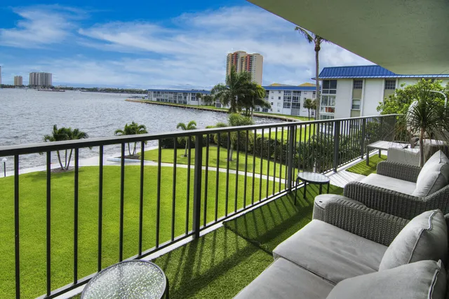 a view of a balcony with an iron fence