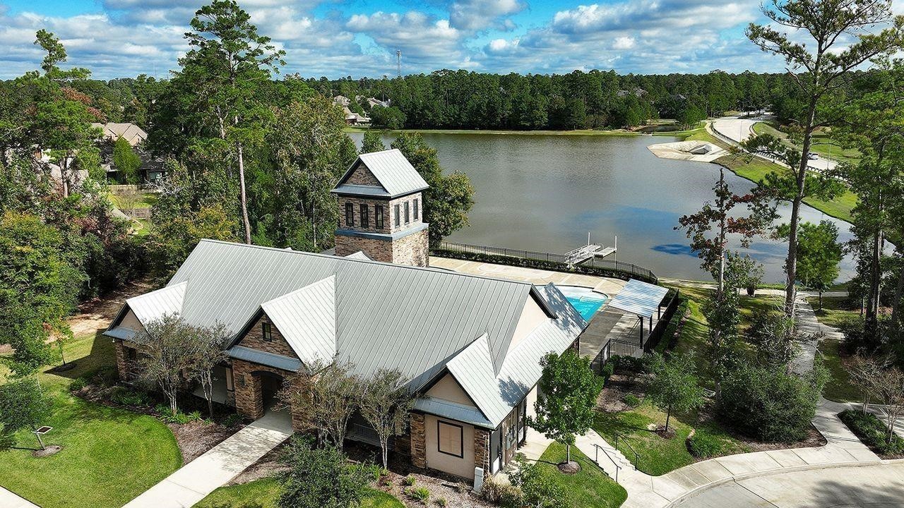 330 Mill Creek Road Pinehurst, TX 77362 - Photo 30 of 36 an aerial view of house with yard and lake