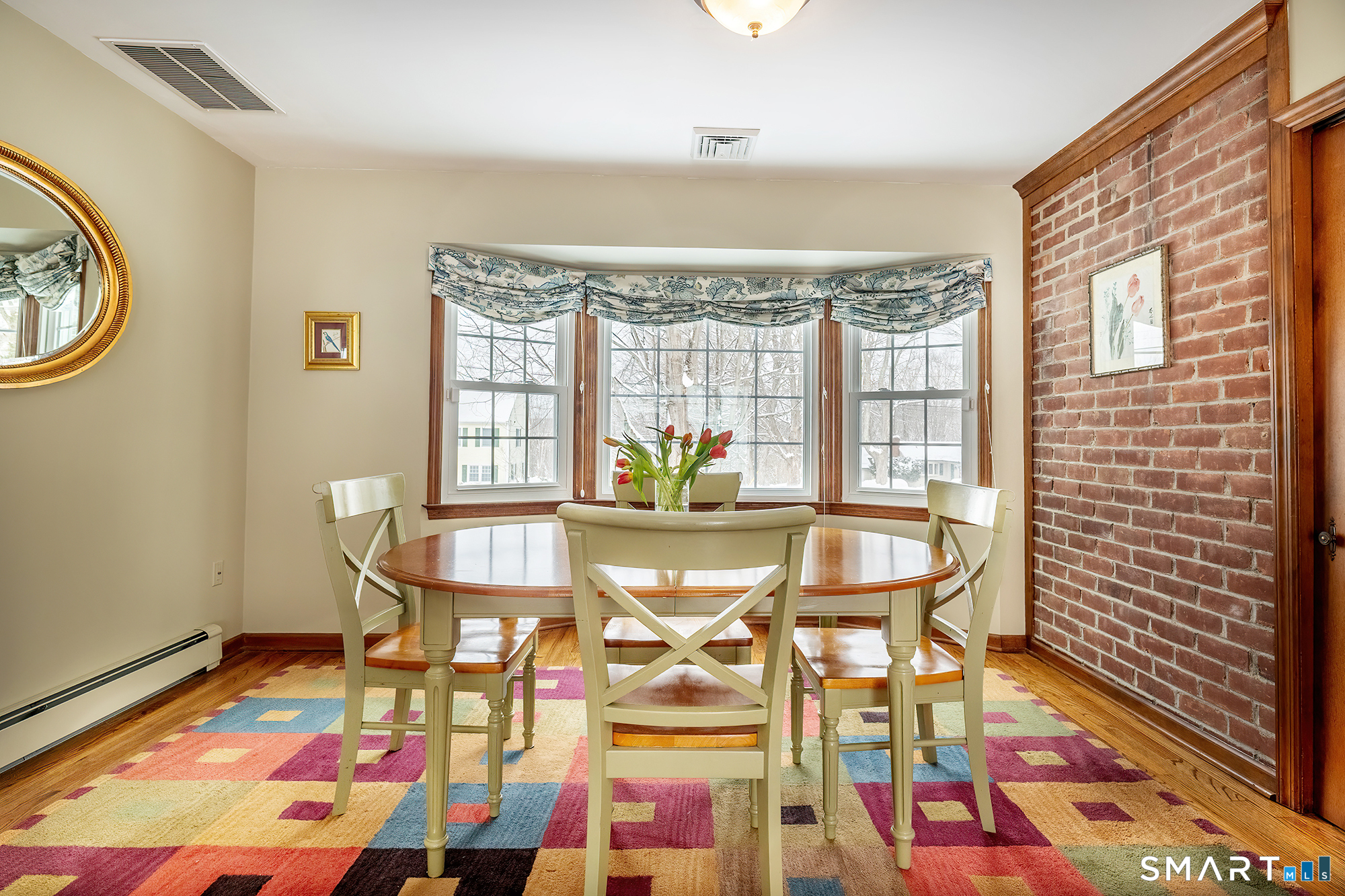 35 Highview Drive Ridgefield, CT 06877 - Photo 11 of 35 a dining room with furniture and a rug